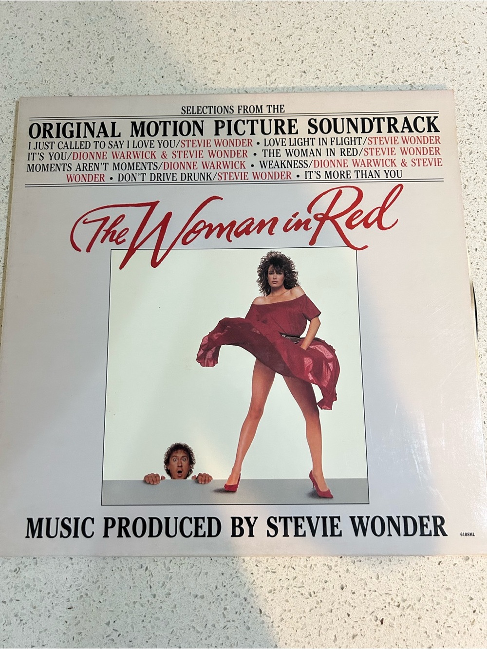 The Woman in Red Original Motion Picture Soundtrack - Red Cover Art and record